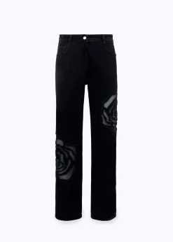 BLACK DENIM JEANS WITH CUT-OUT ROSE DESIGN