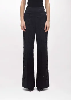 FLARED PANTS WITH CUT-OUT ROSE DESIGN