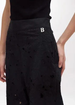 FLARED PANTS WITH CUT-OUT ROSE DESIGN