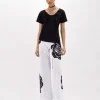 T-SHIRT WITH DRAPED DETAILS AND NECKLACE